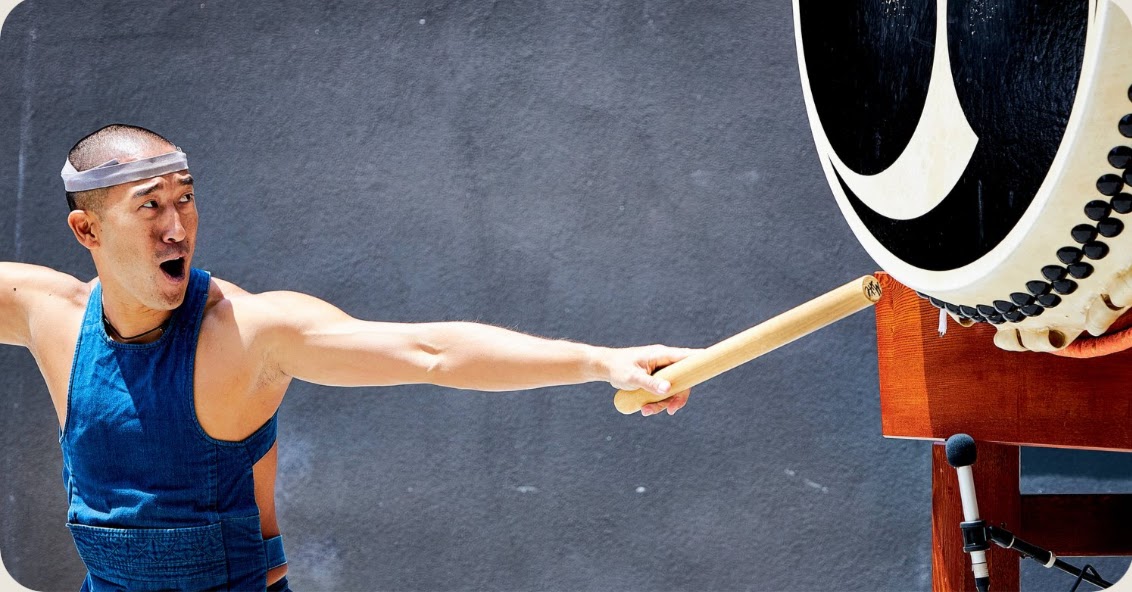 Michael Gonhata extending through an odaiko strike